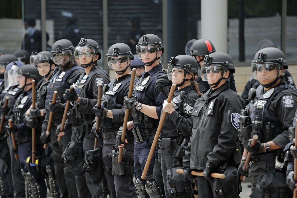 Police officers surround Seattle City Hall on June 3.