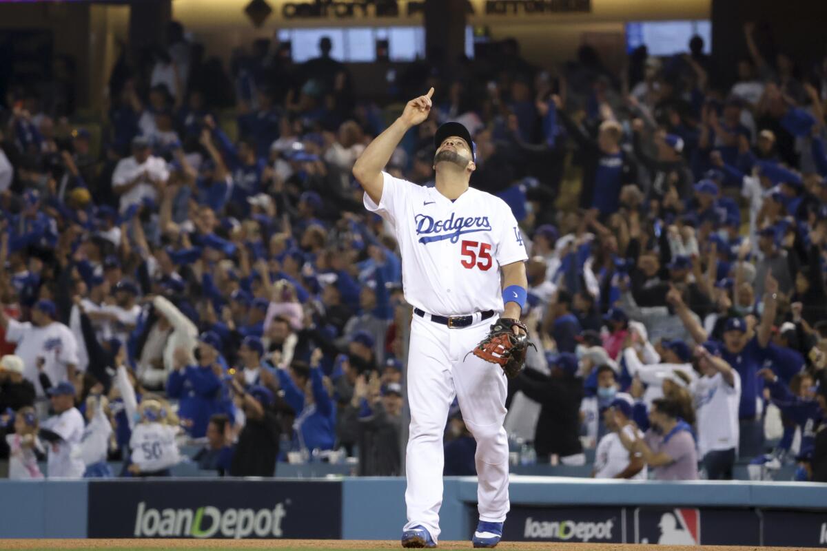 The Dodgers' Albert Pujols celebrates after defeating the Atlanta Braves 11-2 in Game 5 of the NCLS.