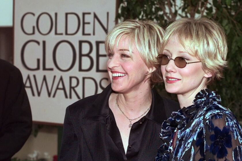Actresses Ellen DeGeneres, left, and Anne Heche arrive at the 55th Annual Golden Globe Awards in Beverly Hills, Calif., Sunday, Jan. 18, 1998. Ellen is nominated for Best Actress in a comedy television series for her role in "Ellen." (AP Photo/Mark J. Terrill)