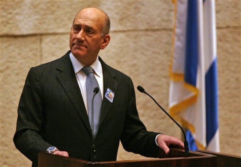Israeli Prime Minister Ehud Olmert speaks during a memorial session at the Knesset, Israel's Parliament, marking the 13th anniversary of Israeli Prime Minister Yitzhak Rabin's assassination, in Jerusalem, Monday, Nov. 10, 2008. Yitzhak Rabin was assassinated on Nov. 4 1995 by a Jewish ultra-nationalist as he left a peace rally in Tel Aviv. Israel officially marks the 13th anniversary of Rabin's slaying on Monday, according to the Hebrew calendar. (AP Photo/Eliana Aponte, Pool)