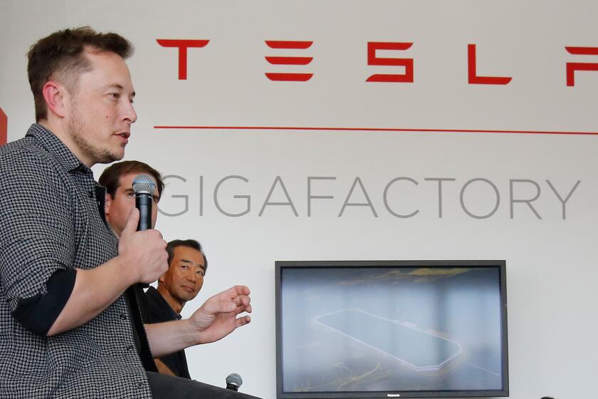 Elon Musk speaks at the recent grand opening of Tesla's Gigafactory 1. The Nevada battery production facility is still under construction.