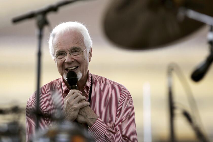 FILE - Peter Nero, leader of the Philly Pops, smiles during a sound check on a stage at the foot of the Philadelphia Museum of Art steps, Monday, July 4, 2005, in Philadelphia, as he and other artists prepare to give a free concert with Elton John to celebrate America's Independence and to raise awareness of HIV/AIDS. Nero, a Grammy-winning pianist who interpreted pop songs through classical and jazz forms and served as the Philly Pops' conductor for more than three decades, died Thursday, July 6, 2023. He was 89. (AP Poto/Carolyn Kaster, File)