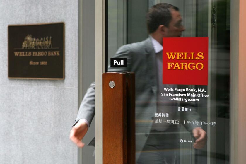 SAN FRANCISCO - MAY 04: A Wells Fargo customer enters a bank branch May 4, 2009 in San Francisco, California. Regulators have notified Wells Fargo Bank that it might need to firm up its finances after a government "stress test" showed that the bank might not survive if the recession deepens. (Photo by Justin Sullivan/Getty Images) ** OUTS - ELSENT, FPG, CM - OUTS * NM, PH, VA if sourced by CT, LA or MoD **