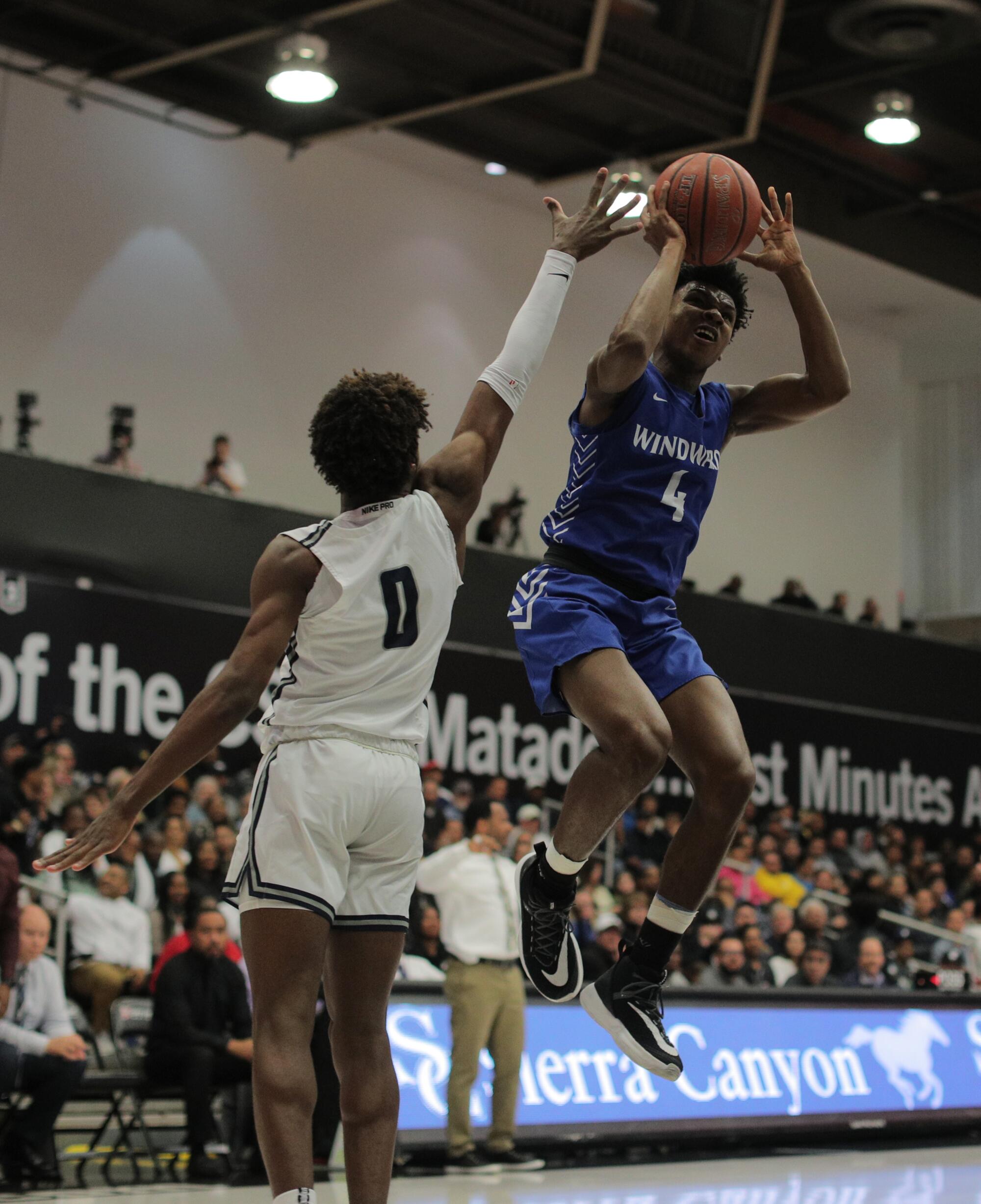 Windward guar Dylan Andrews pulls up for a jumper against Sierra Canyon guard Bronny James.