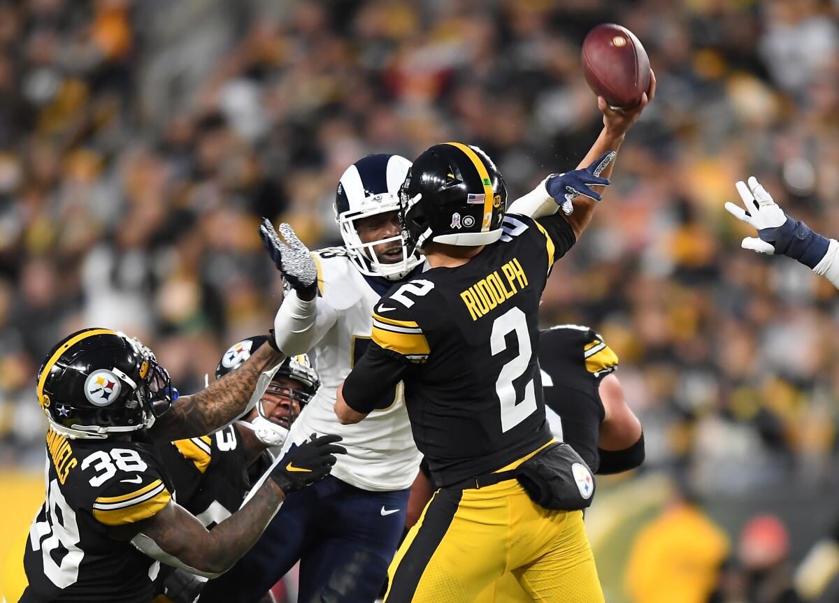 Rams linebacker Cory Littleton hits the arm of Steelers quarterback Mason Rudolph to force an incomplete pass in the second quarter.
