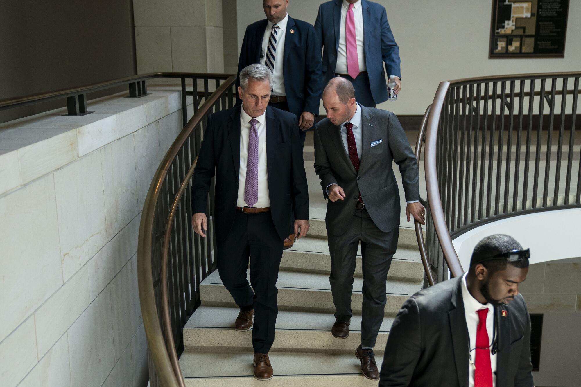 Men walking on a staircase.