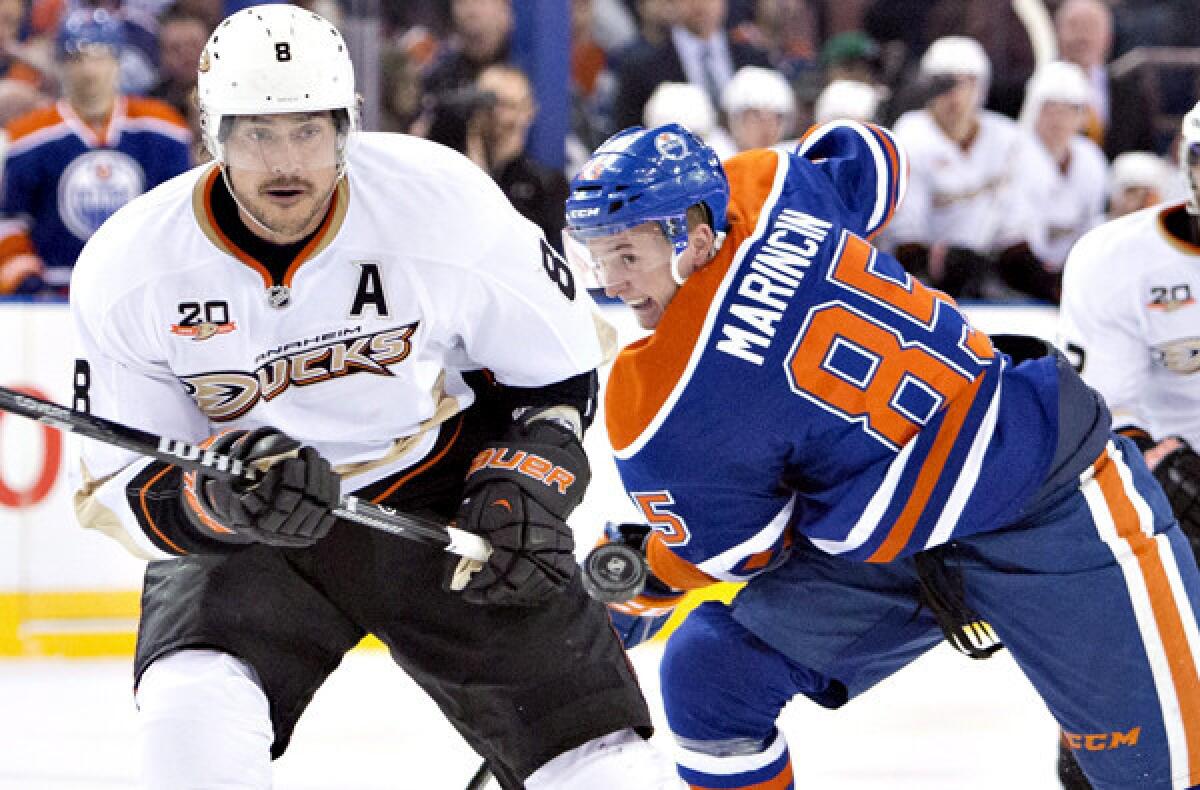 Ducks right wing Teemu Selanne tracks the puck during a battle against Edmonton's Martin Marincin in a game last month.
