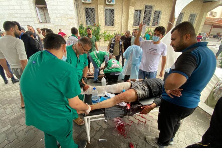 GAZA CITY, GAZA - NOVEMBER 14: (EDITORS NOTE: Image depicts graphic content) Injured Palestinians receive medical treatment at the yard of the Al-Ahli Baptist Hospital after Israel's airstrikes as Israeli army's strikes continue on its 39th day in Gaza Strip on November 14, 2023. (Photo by Montaser Alsawaf/Anadolu via Getty Images)