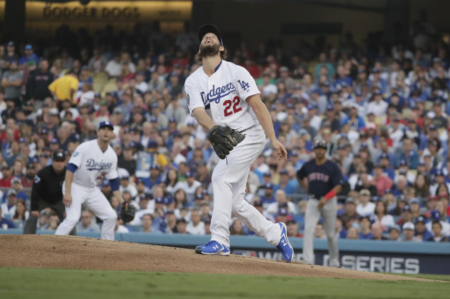 Dodger pitcher Clayton Kershaw follows the flight of the ball on Steve Pearce’s first inning two run homer.