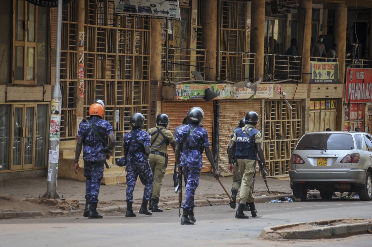 Security forces patrol a street in Kampala, Uganda, on Thursday.