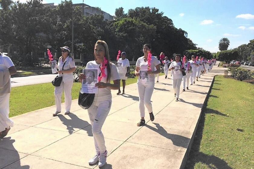 Ladies in White demand the release of political prisoners as they march in Havana on Dec. 21.