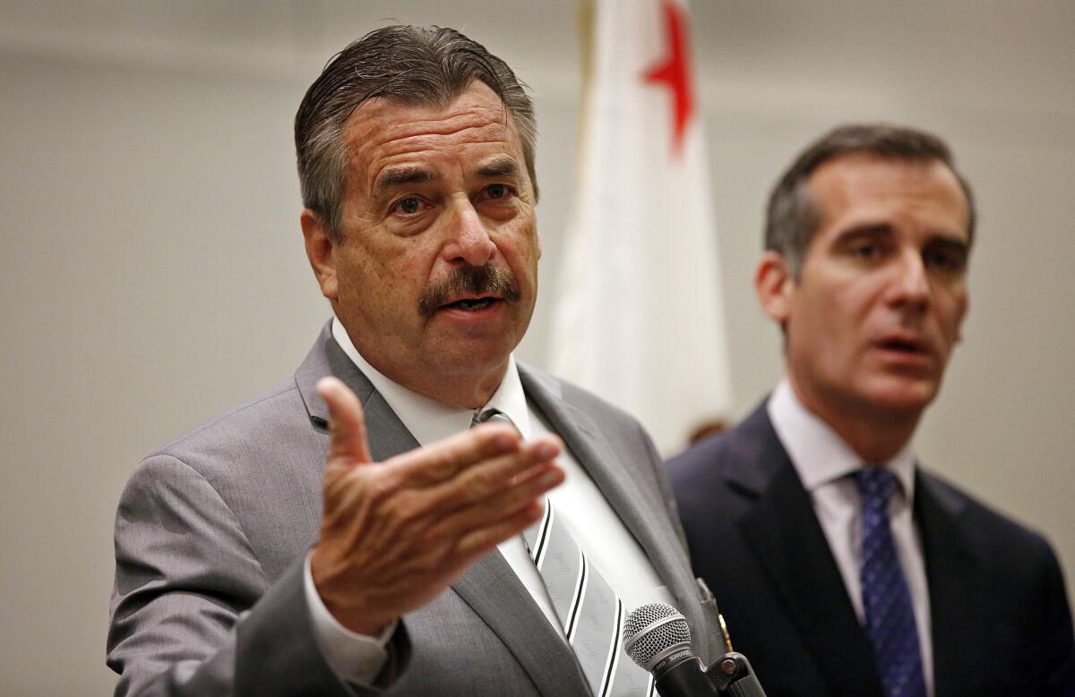 Mayor Garcetti, right, listens as LAPD Chief Charlie Beck, announces the details of an arrest regarding a kidnap and sexual assault case, which took place on April 3, 2016.