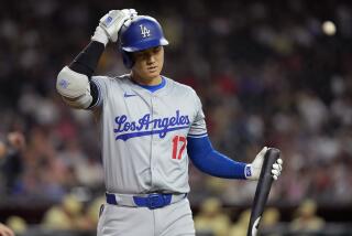 Los Angeles Dodgers' Shohei Ohtani walks to the dugout after striking out during the seventh inning of a baseball game against the Arizona Diamondbacks, Tuesday, April 30, 2024, in Phoenix. (AP Photo/Matt York)