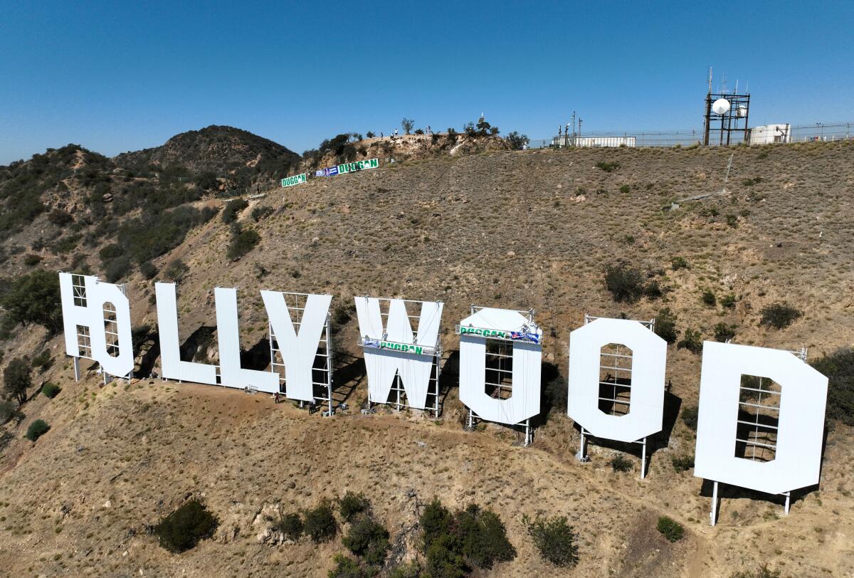 The Hollywood sign gets a fresh coat of white paint in October.