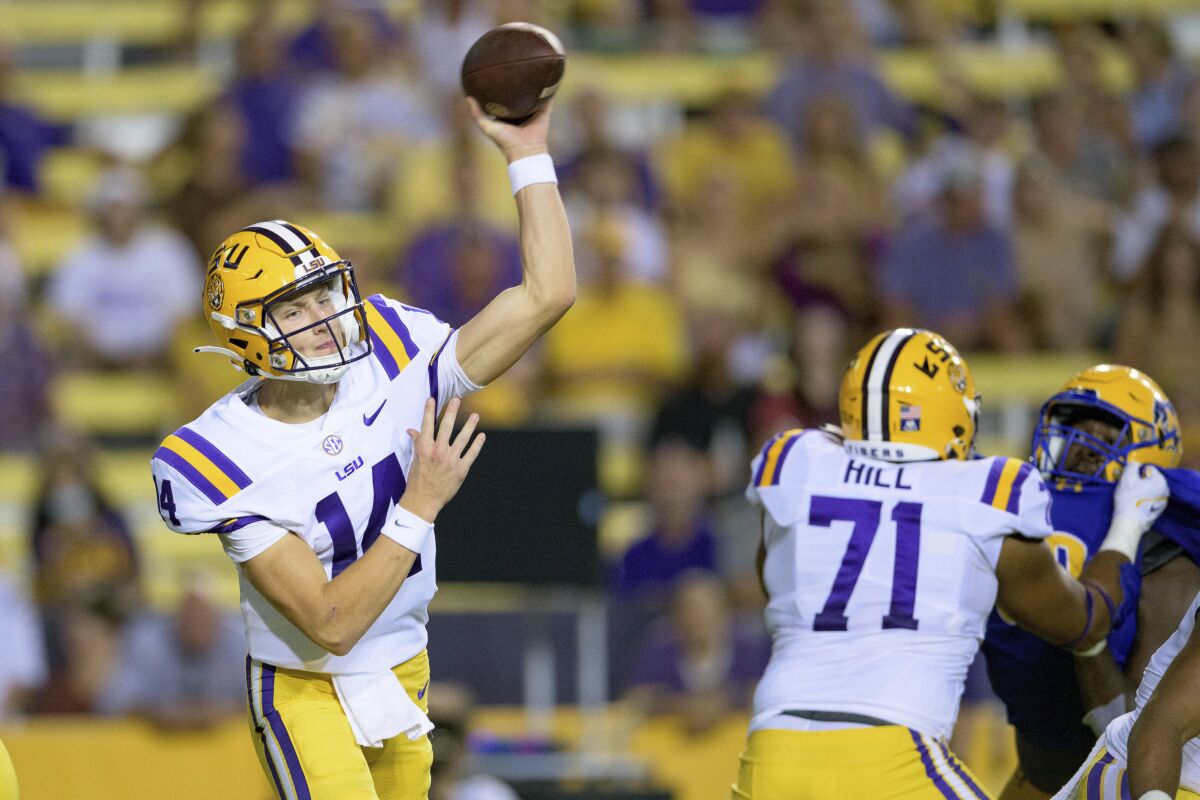 LSU quarterback Max Johnson (14) throws a pass during the first half the team's NCAA college football game against McNeese State in Baton Rouge, La., Saturday, Sept. 11, 2021. (AP Photo/Matthew Hinton)
