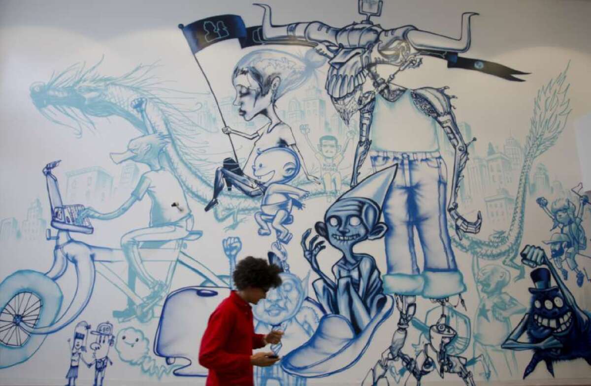 Walls on Facebook's Menlo Park, Calif., campus are decorated by graffiti artist David Choe.