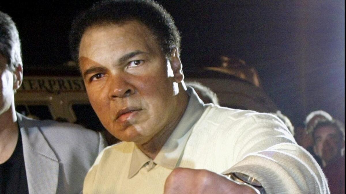 The late boxing legend Muhammad Ali, among the best known sufferers of Parkinson's disease, is shown in 2003 at the U.S. premiere of his tribute book "Greatest Of All Time" in Miami Beach.