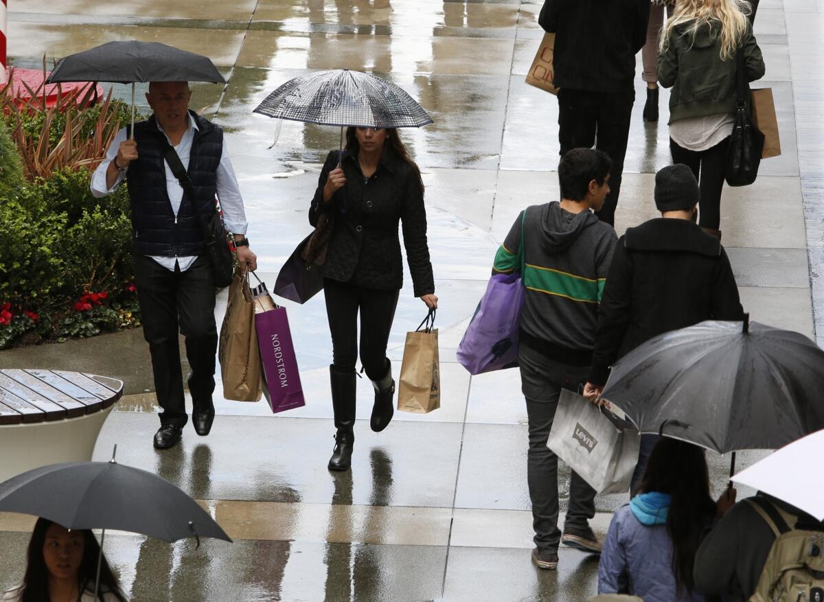 Consumer confidence rebounded in December, reaching its highest level since July, according to a preliminary index by Thomson Reuters/University of Michigan. Above, Black Friday shoppers in Santa Monica flock to the Third Street Promenade.