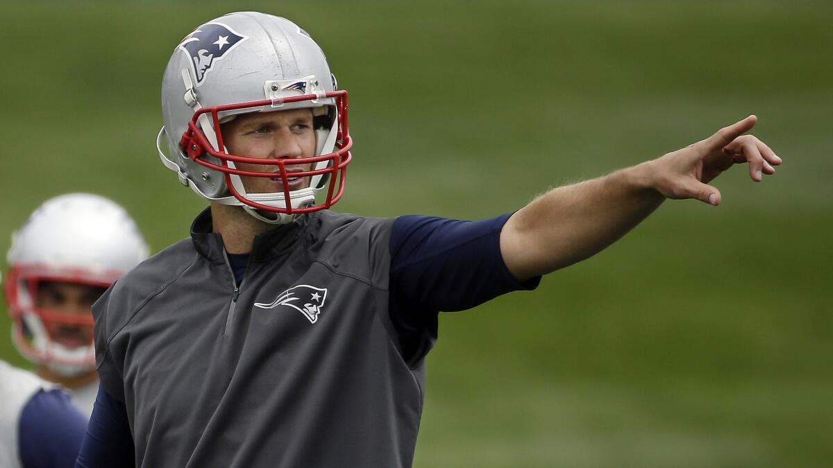 New England Patriots quarterback Tom Brady calls out signals during a team minicamp in Foxborough, Mass., on June 17, 2015.