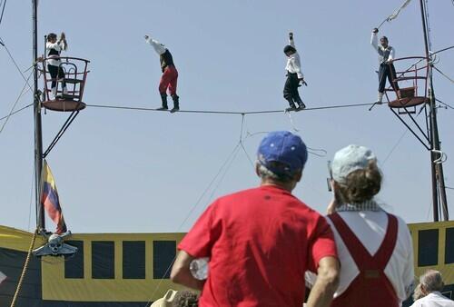 Fair goers watching captivating high wire