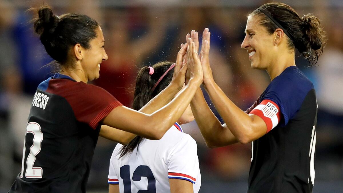 Christen Press, left, is congratulated by Carli Lloyd after scoring against Costa Rica on Friday.