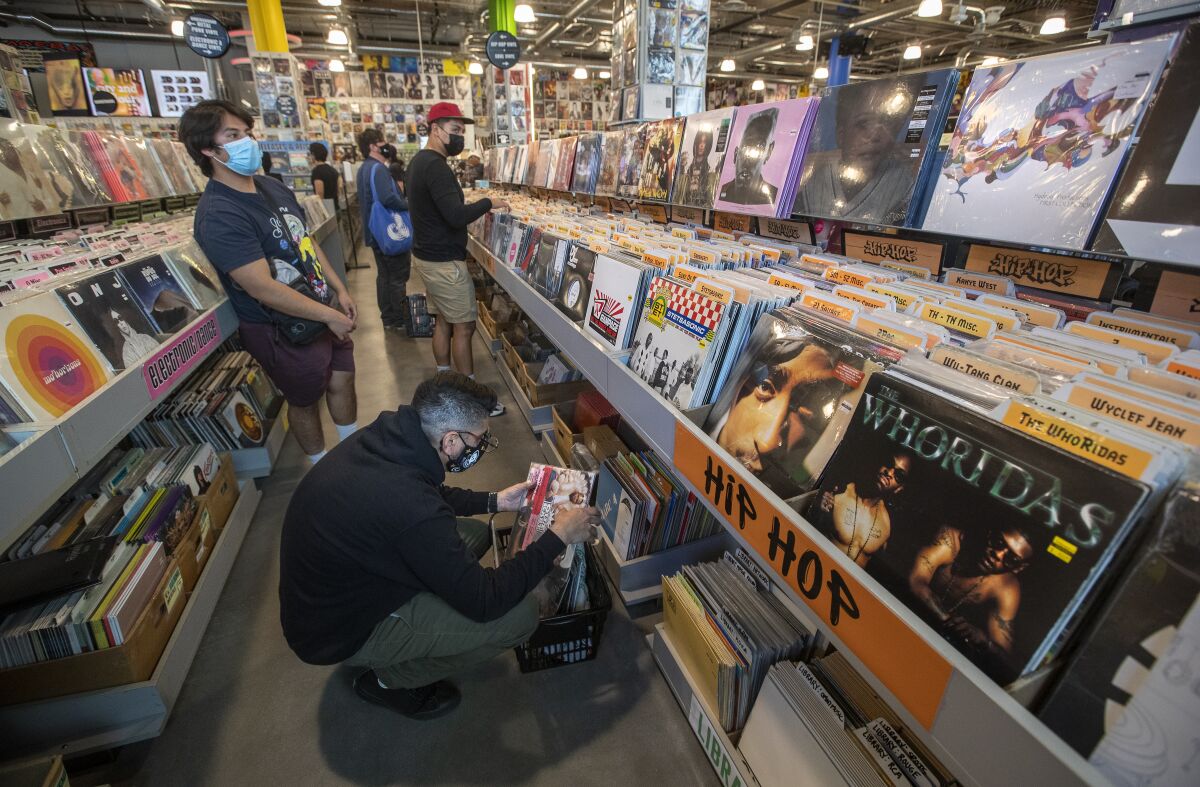 Customers browse inside the Hip Hop section at Amoeba Music on Hollywood Blvd in Hollywood.
