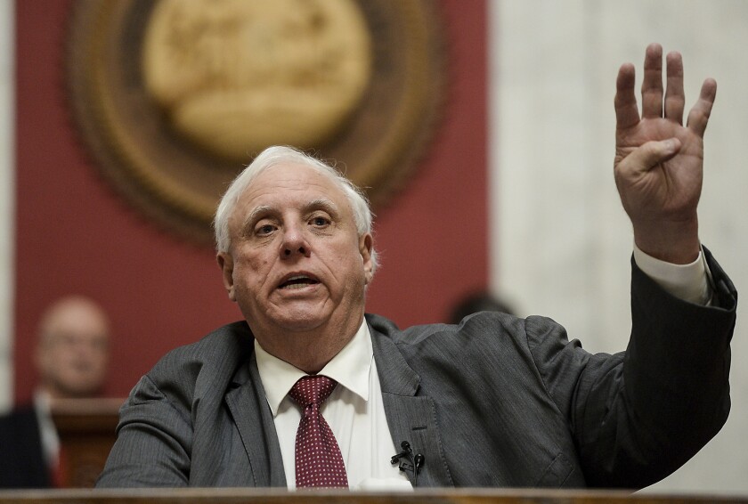 FILE - West Virginia Gov. Jim Justice gives his State of the State speech in the House Chambers, Thursday, Jan. 27, 2022, at the West Virginia State Capitol in Charleston, W.Va. Gov. Jim Justice has consistently missed deadlines in recent months to pay the U.S. government the millions of dollars he owes in penalties for unsafe working conditions at his coal mines, according to federal court documents. (Chris Dorst/Charleston Gazette-Mail via AP, File)