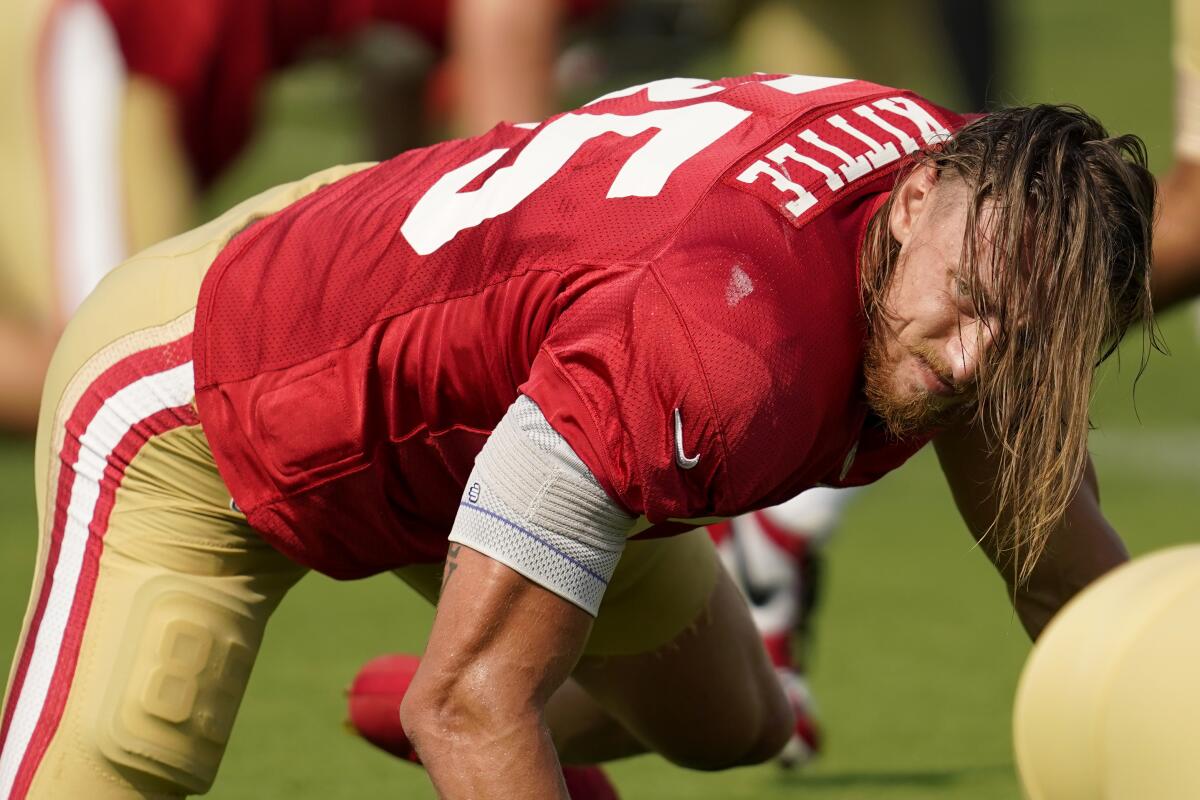 San Francisco 49ers tight end George Kittle stretches before a practice session in August.
