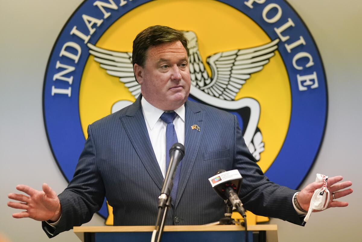 Todd Rokita speaks at a microphone.