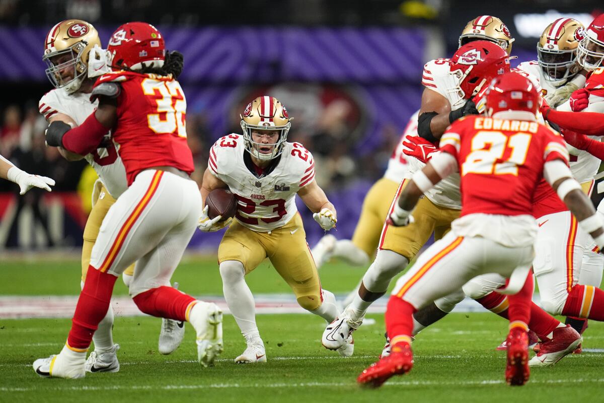 San Francisco 49ers running back Christian McCaffrey carries the ball during the first quarter.