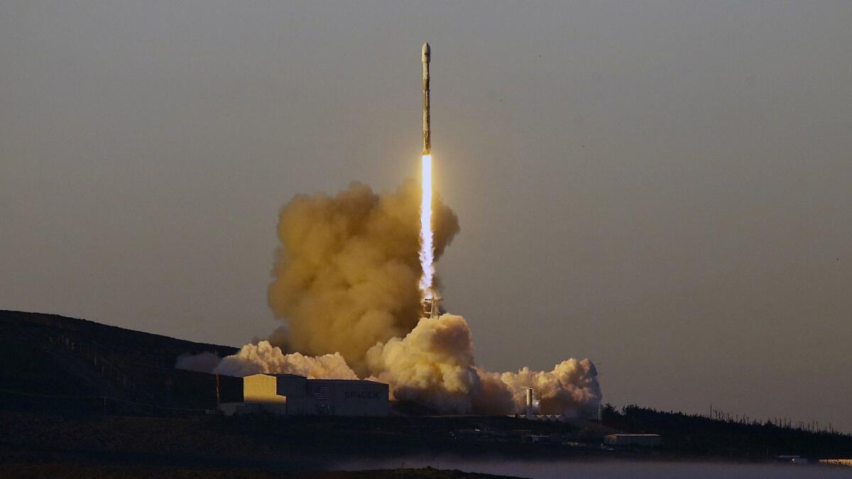 A Falcon 9 rocket lifts off from Vandenberg Air Force Base, Calif., on Friday, March 30, 2018.
