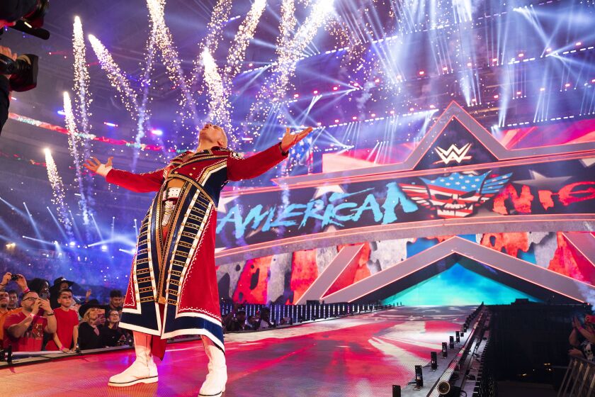 Cody Rhodes makes his entrance during WrestleMania 38 in Arlington, Texas, on April 3, 2022. Rhodes will be part of the main event for WrestleMania 39 in Los Angeles on Sunday, April 2, 2023, against Roman Reigns. (WWE via AP)