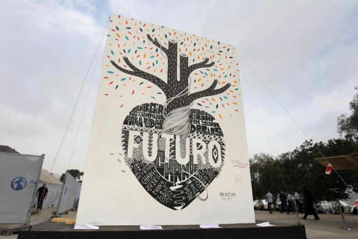 Graffiti art titled "Future," advocating renewable energy and other action against global warming, is exhibited during the U.N. Climate Change Conference in Lima, Peru, on Dec. 12.