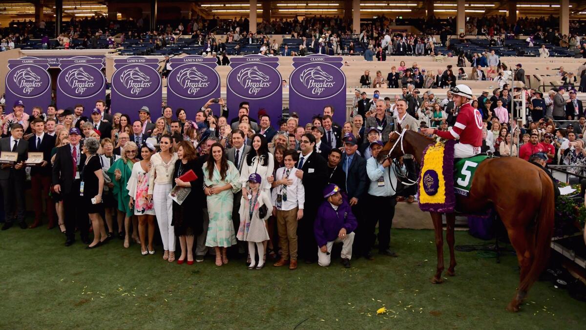 Jockey Florent Geroux celebrates after riding Gun Runner to victory in the Breeders' Cup Classic at Del Mar on Saturday.