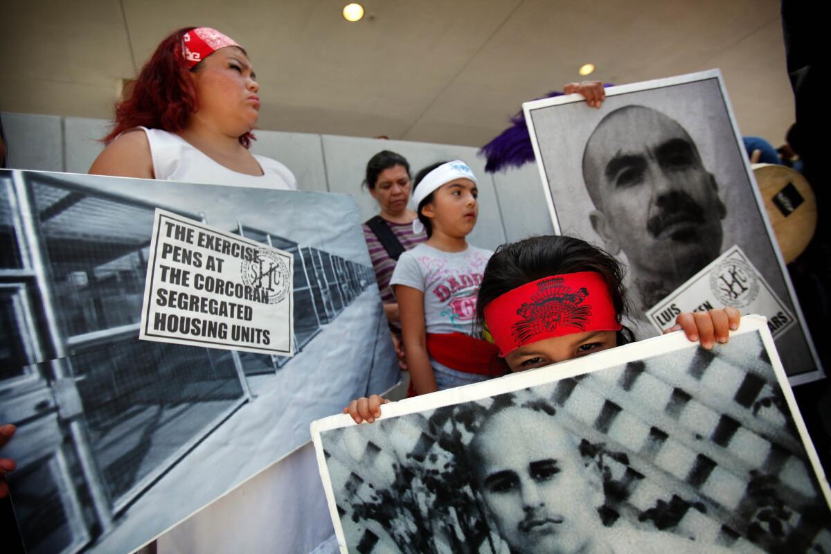 Three-year-old Salome Cuauhtemoc participates with his family in a rally in downtown L.A. in a show of support for state inmates on a hunger strike over prison conditions and to seek justice for Trayvon Martin, who was killed in Florida by George Zimmerman.