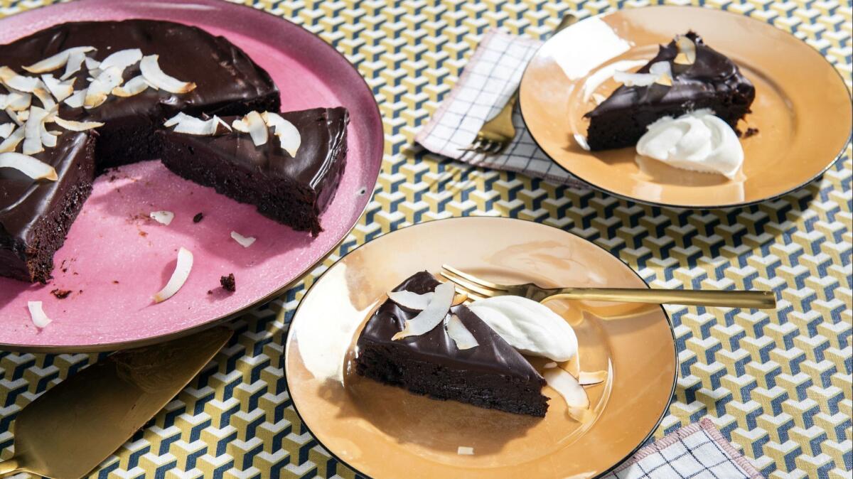 Coconut oil in the cake batter and coconut milk in the ganache topping lend a toasty taste to this cake.