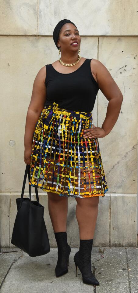 Who: Erika Brown, 30, Northeast Baltimore resident, Capella University counseling graduate student Spotted at: For the Culture: Africana Pop-Up event at Tightfisted Fashion: Resale & Consignment Store What she wore: Black jersey romper from Gap; multicolor cage skirt from Regal Clothes; black stretch lace pointy-toe booties from Aldo; gold chain choker and earrings that were gifts; Old Navy black tote; and black turban from Beauty Plus. Building upon her fashion foundation: “I live in black, and then everything revolves around that.”