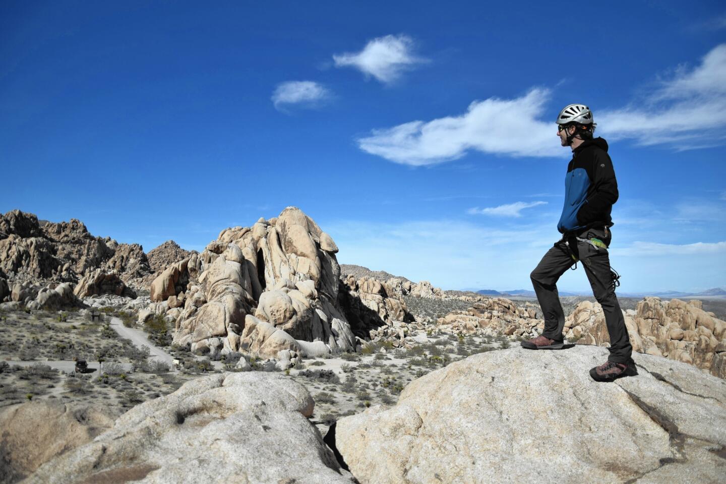 Roddy McCalley of Cliffhanger Guides stands on top of Pixie Rock in Joshua Tree National Park.