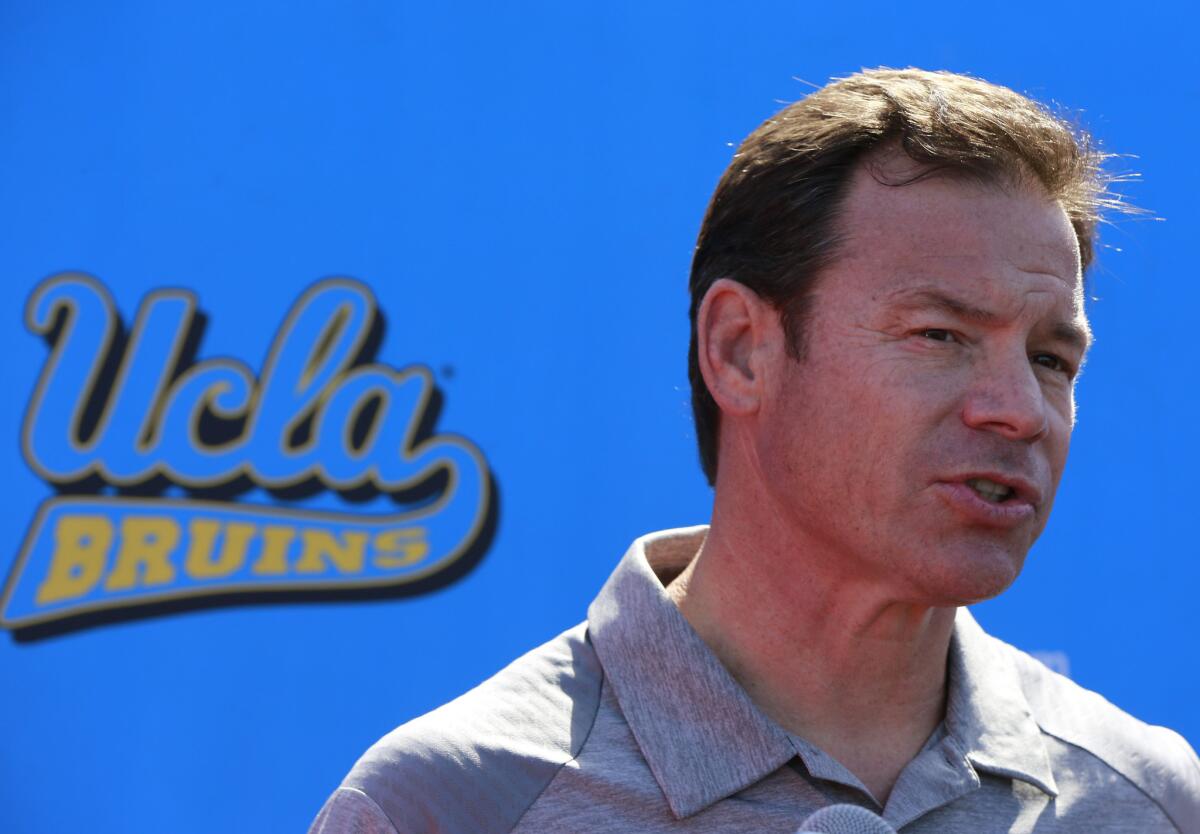 UCLA Coach Jim Mora speaks to reporters during the Bruins' annual NFL pro day on March 15.