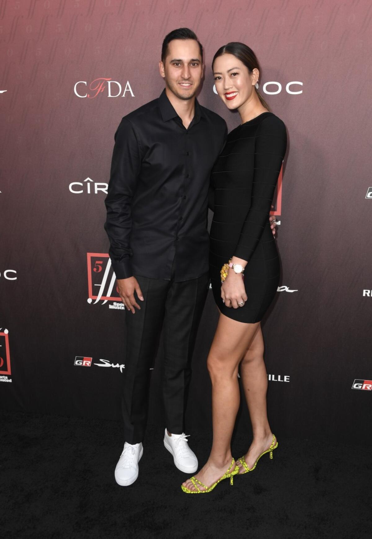 Jonnie West and Michelle Wie attend the Sports Illustrated Fashionable 50 on July 18, 2019, in Los Angeles.