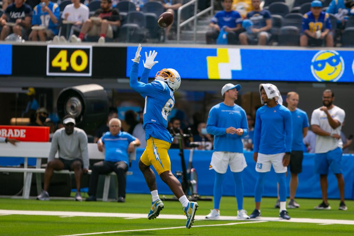 Chargers wide receiver Mike Williams tries to haul in a pass during practice at SoFi Stadium on Sunday.