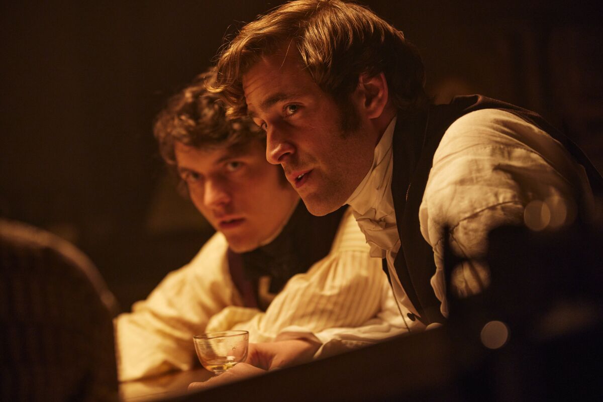 Two men in 19th century clothing  in the movie "Emily."