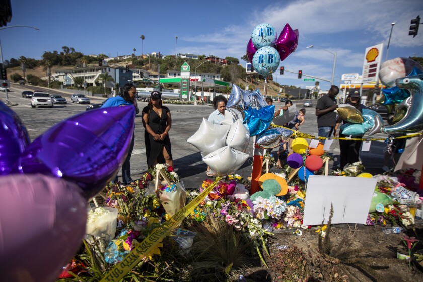 Candles, balloons and flowers were left at the site of a fatal crash