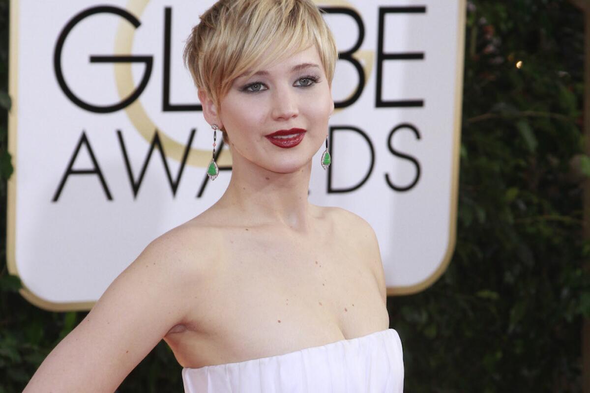 Jennifer Lawrence arrives for the 71st Golden Globe Awards show at the Beverly Hilton Hotel.