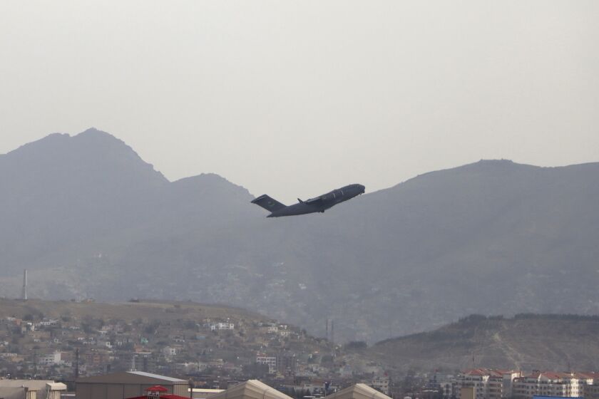 A U.S military aircraft takes off from the Hamid Karzai International Airport in Kabul, Afghanistan, Monday, Aug. 30, 2021. (AP Photo/Wali Sabawoon)