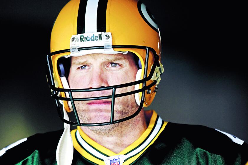 Green Bay Packers quarterback Brett Favre waits to be introduced before a game against the Seattle Seahawks in Green Bay on Jan. 1, 2006.