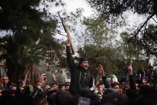 People with their arms raised, one holding a rifle.