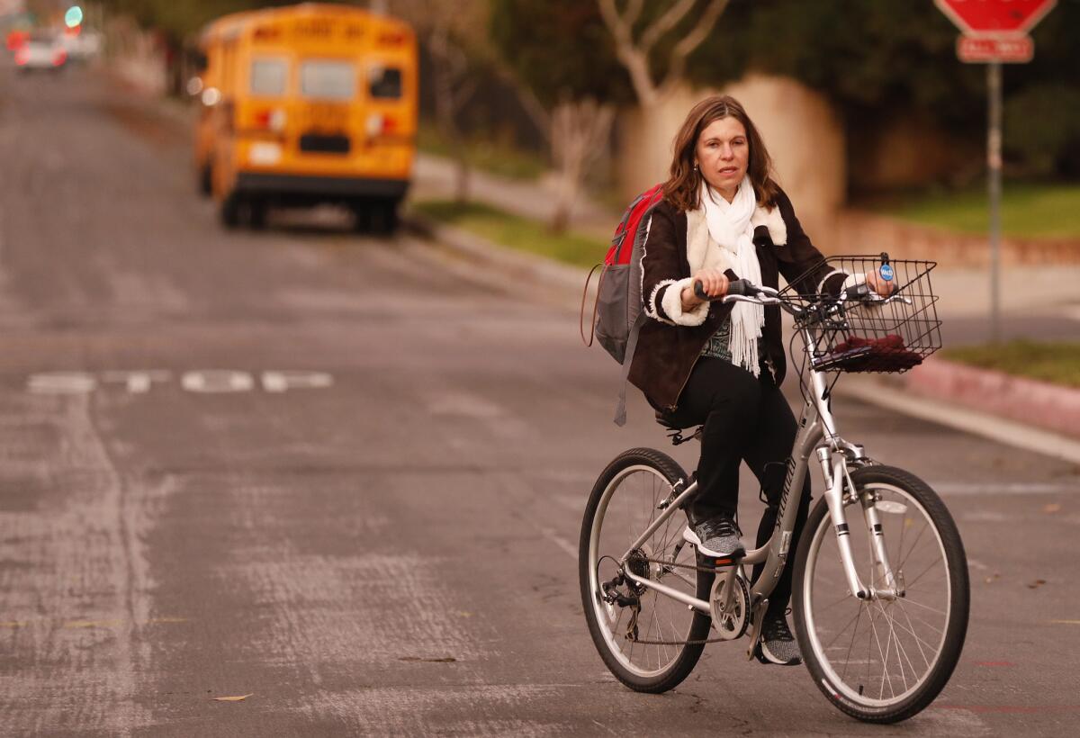 Fabiana Lamm, a school psychologist in the Valley, rides her bike to her work. The focus has been on the teachers, but the union includes positions such as hers.