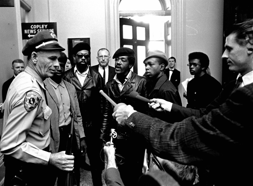 Black Panther Party members and police officers at the California Capitol in 1967.