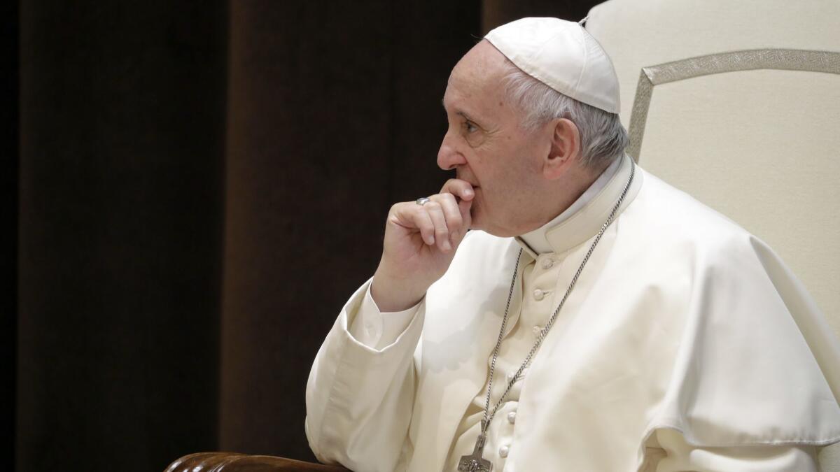 Pope Francis on Saturday meets a group of children who traveled from Milan in northern Italy to the Vatican.